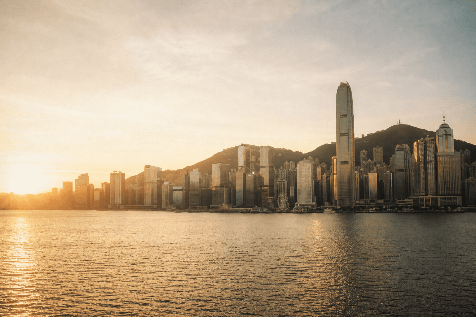 Victoria Harbour and the Hong Kong skyline at golden hour
